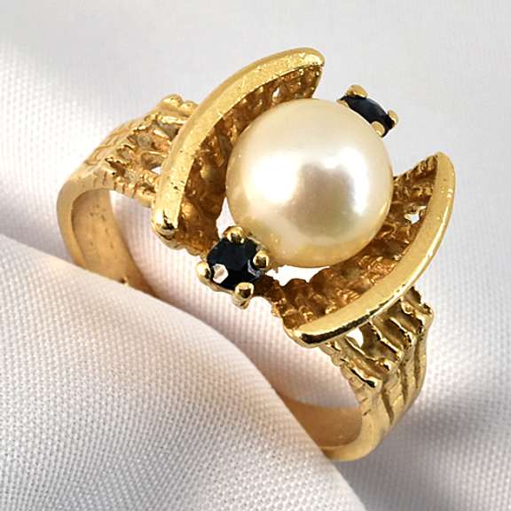 Feminine Pearl Ring with Sapphire Accents