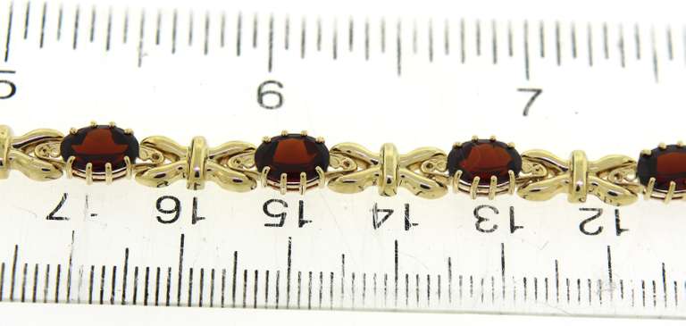 Pretty Oval Garnet Bracelet in 14kt