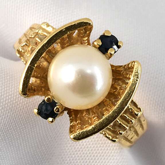 Feminine Pearl Ring with Sapphire Accents