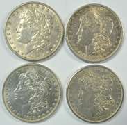 4 Upper end Morgan Silver Dollars. All different