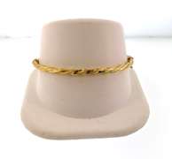 Pretty 18kt yellow gold twisted bangle bracelet