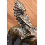 Native American Chief Rides Horse