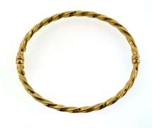 Pretty 18kt yellow gold twisted bangle bracelet