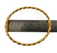 Pretty 18kt yellow gold twisted bangle bracelet