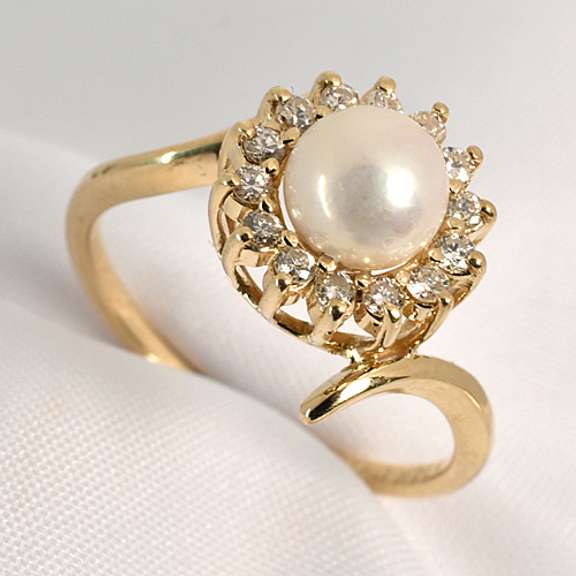 Feminine Pearl and Diamond Ring