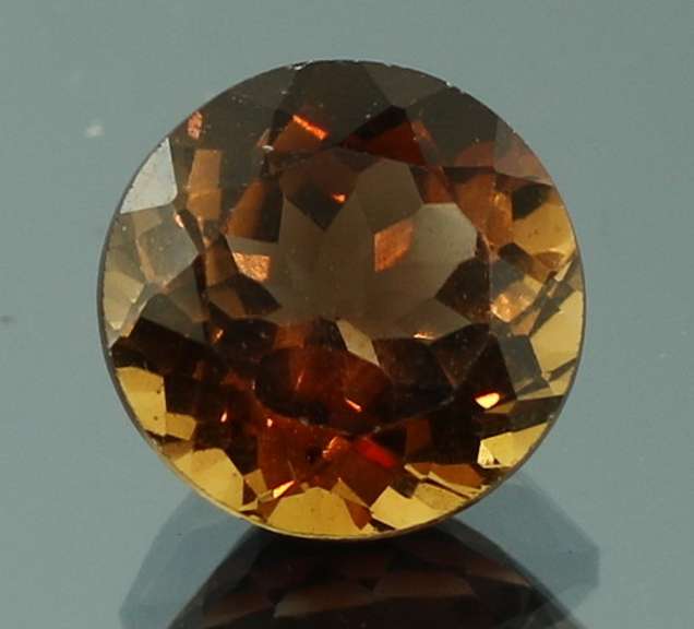 Rich red amber 4.76ct Imperial Topaz solitaire