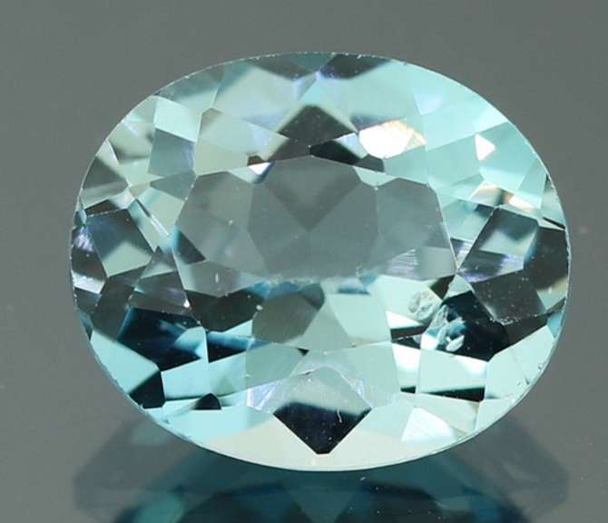 Brilliant 5.79ct oval cut Topaz center stone