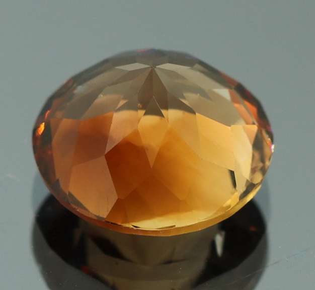 Rich red amber 7.67ct Imperial Topaz solitaire
