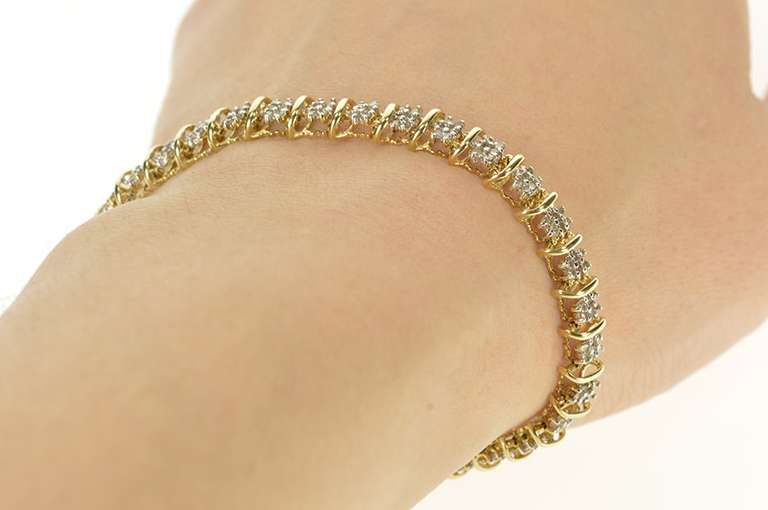 10K Yellow Gold 0.99 Ctw Diamond Cluster Wavy Link Tennis Bracelet