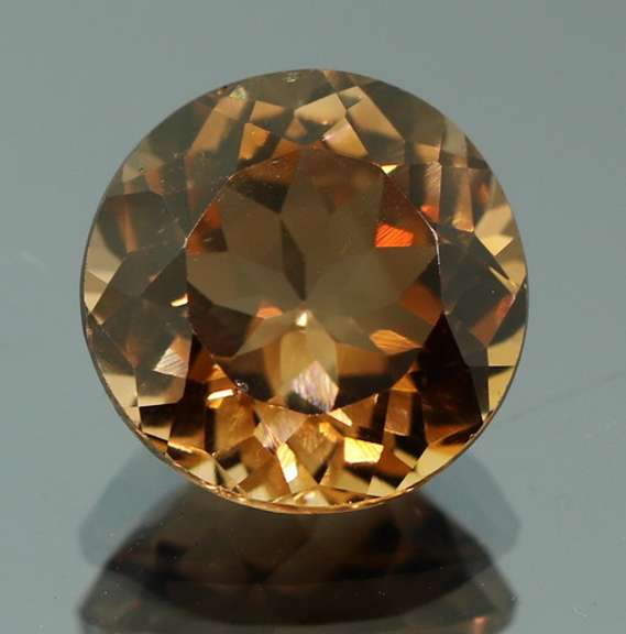 Rich red amber 7.67ct Imperial Topaz solitaire