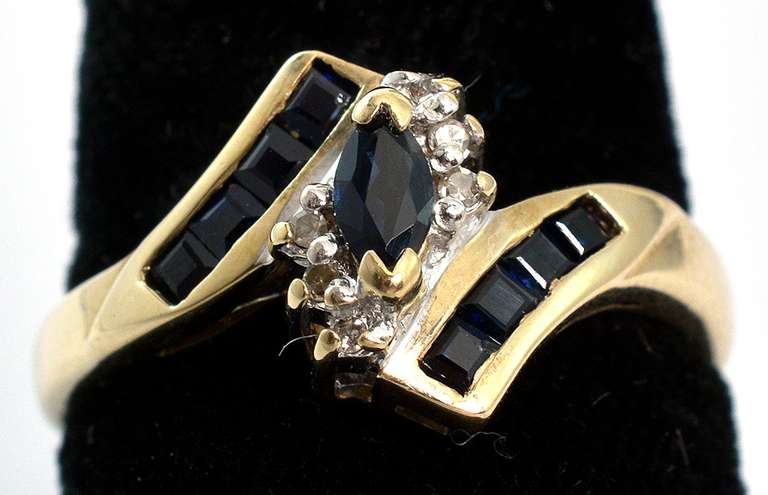 Eye-Catching Sapphire & Diamond Accent Ring in Yellow Gold