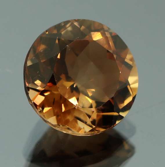 Rich red amber 7.67ct Imperial Topaz solitaire