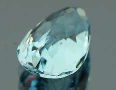 Very vivid 7.23ct pear cut Topaz center stone