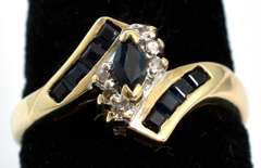 Eye-Catching Sapphire & Diamond Accent Ring in Yellow Gold