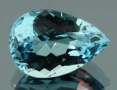 Very vivid 7.23ct pear cut Topaz center stone