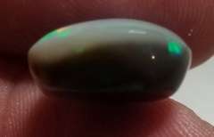 Rare bi-color untreated 6.59ct Welo Black Opal