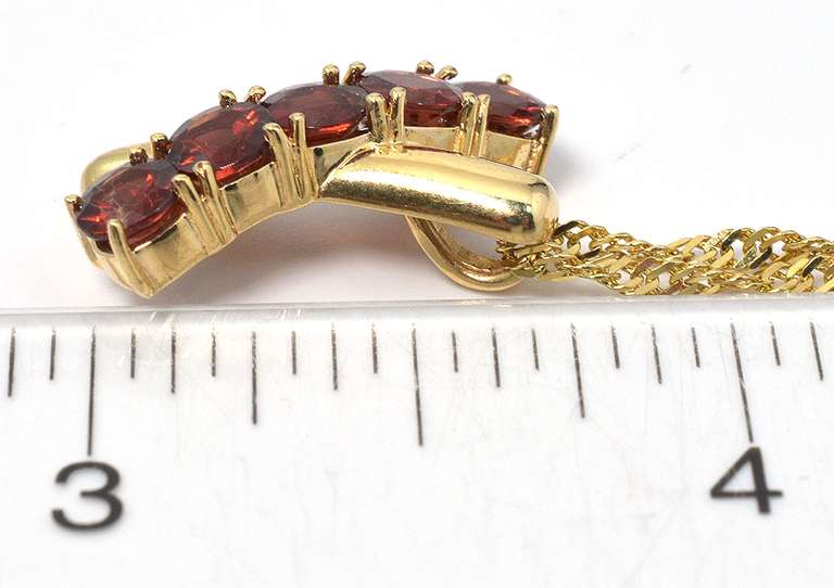 Eye-Catching Garnet X Necklace in 14KT Yellow Gold