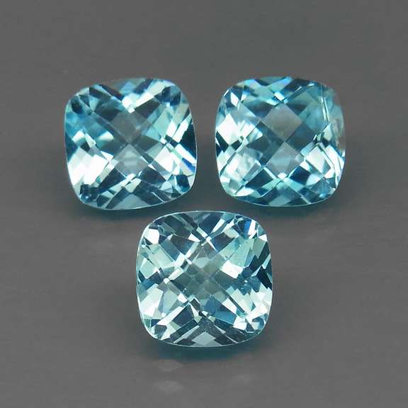 Large 7.73ct vivid blue cushion cut Topaz set