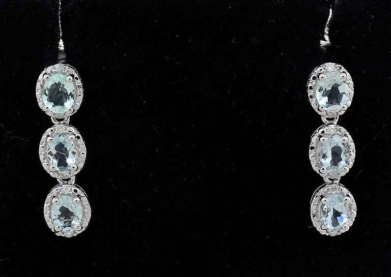 Fashionable Aquamarine & Diamond Dangle Earrings in Sterling Silver