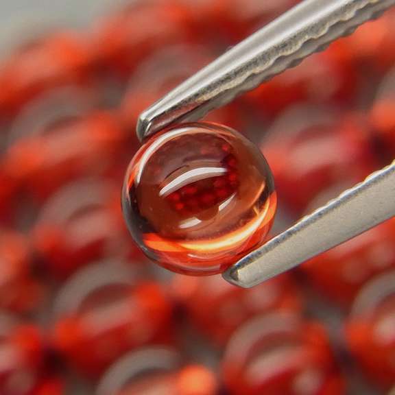 Eye catching 13.20ct red amber Garnet set