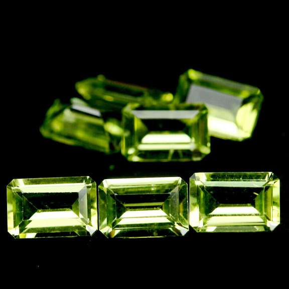 Gorgeous 4.11ct 7 piece emerald cut Peridot set