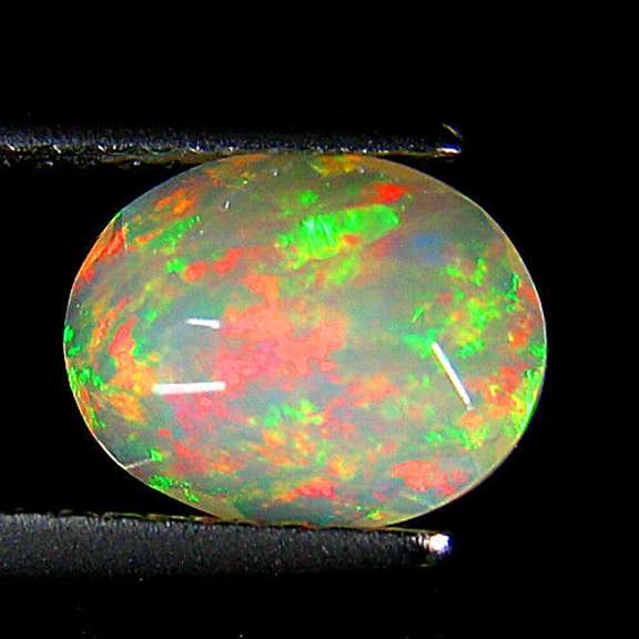 Top fire! 1.25ct smoldering flashing faceted Welo Opal
