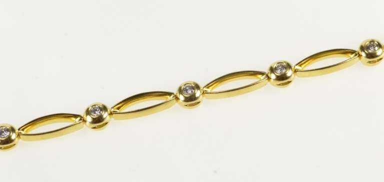 18K Yellow Gold Oval Link Round Diamond Inset Tennis Bracelet