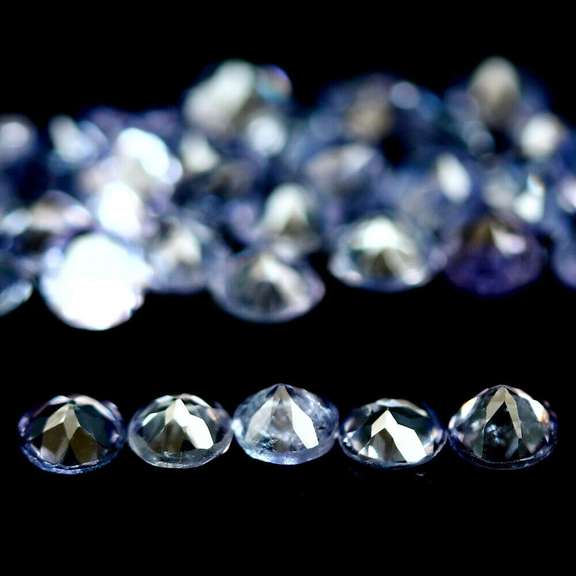 Heavy flashing 6.48ct diamond cut Tanzanite set