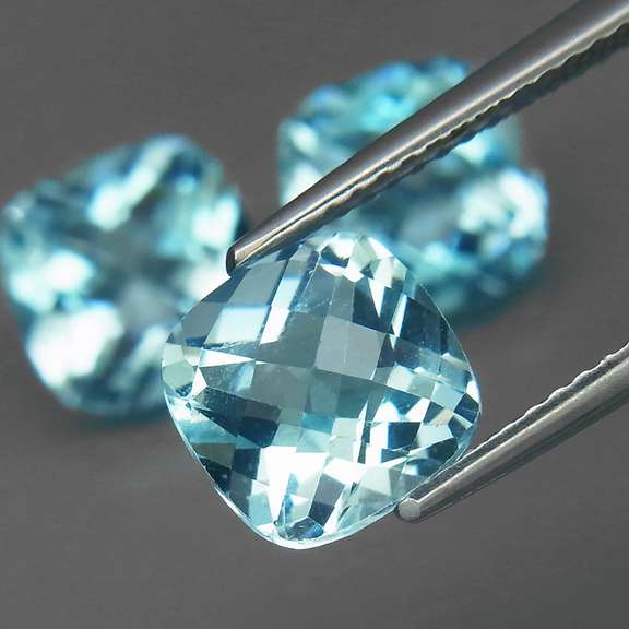 Large 7.73ct vivid blue cushion cut Topaz set