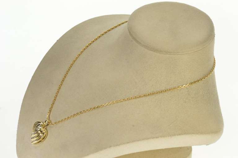 10K Yellow Gold 1.00 Ctw Baguette Diamond Channel Heart Pendant