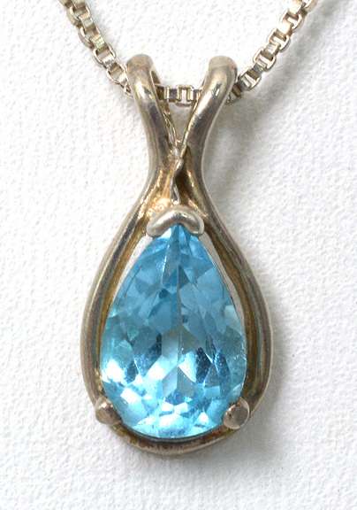Sterling Silver Necklace With Blue Topaz.