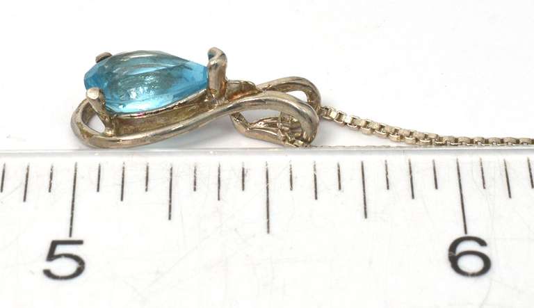 Sterling Silver Necklace With Blue Topaz.