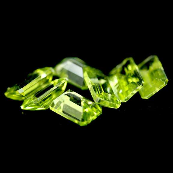Gorgeous 4.11ct 7 piece emerald cut Peridot set