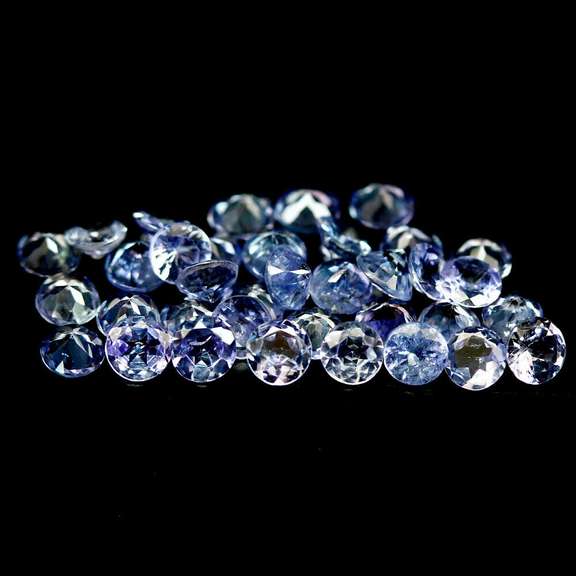 Heavy flashing 6.48ct diamond cut Tanzanite set