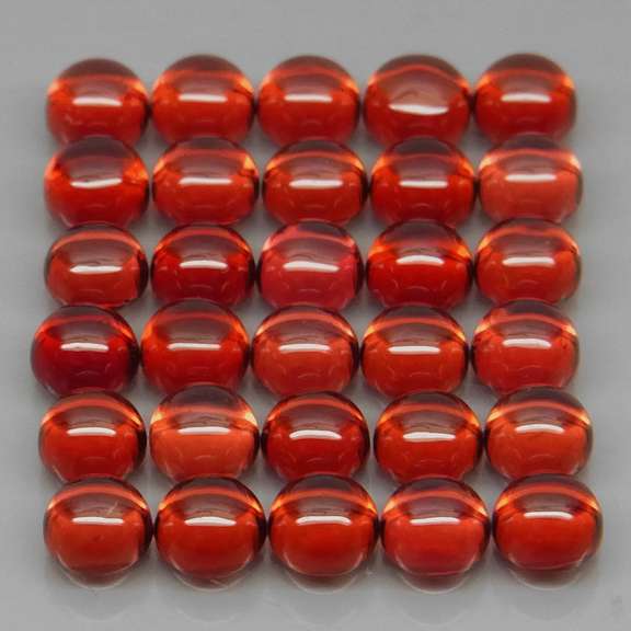 Eye catching 13.20ct red amber Garnet set