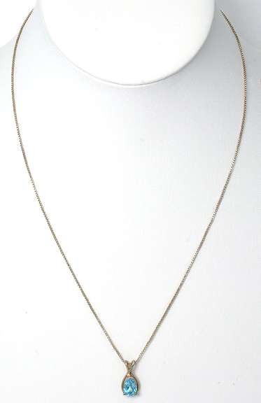Sterling Silver Necklace With Blue Topaz.