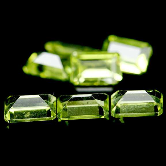 Gorgeous 4.11ct 7 piece emerald cut Peridot set
