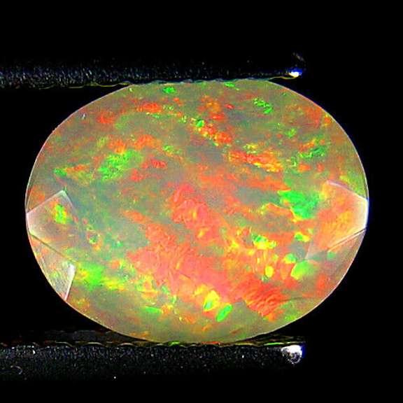 Top fire! 1.25ct smoldering flashing faceted Welo Opal