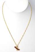 Eye-Catching Garnet X Necklace in 14KT Yellow Gold