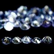 Heavy flashing 6.48ct diamond cut Tanzanite set