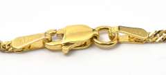 Eye-Catching Garnet X Necklace in 14KT Yellow Gold