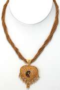 Incredible 22KT Gold Heart Necklace with Tropical Bird Motif