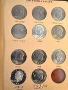 Lot of Eisenhower Dollar Coins in Dansco Album