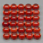 Eye catching 13.20ct red amber Garnet set