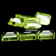 Gorgeous 4.11ct 7 piece emerald cut Peridot set