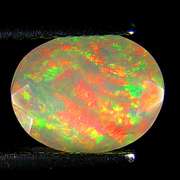 Top fire! 1.25ct smoldering flashing faceted Welo Opal