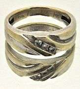 MEN'S 14K WHITE AND YELLOW GOLD DIAMOND BAND.