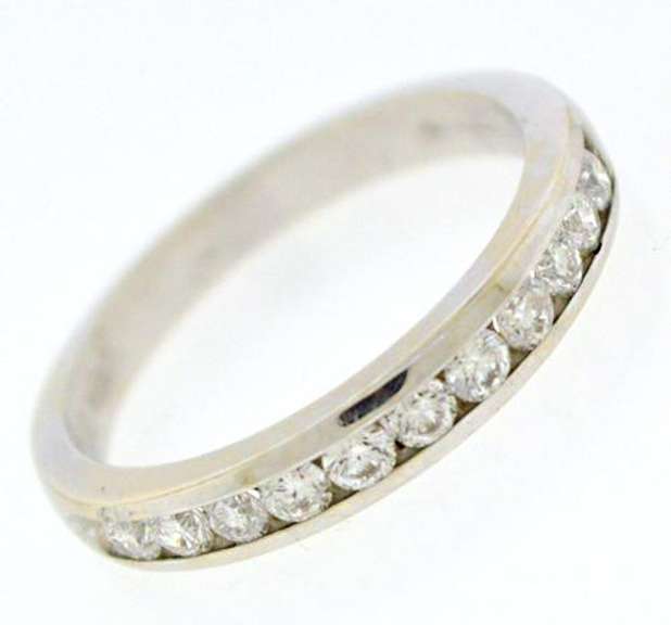 Elegant 18kt Channel Set Diamond Bad Ring