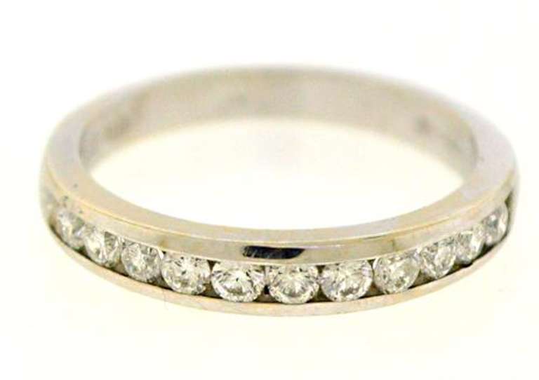 Elegant 18kt Channel Set Diamond Bad Ring