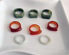 Lot of 8 Carved Jade Rings: Green, Brown and White